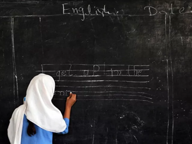 a pakistani female student writes a sentence on a black board at a government school in peshawar on october 25 2012 photo afp a pakistani female student writes a sentence on a black board at a government school in peshawar on october 25 2012 photo afp