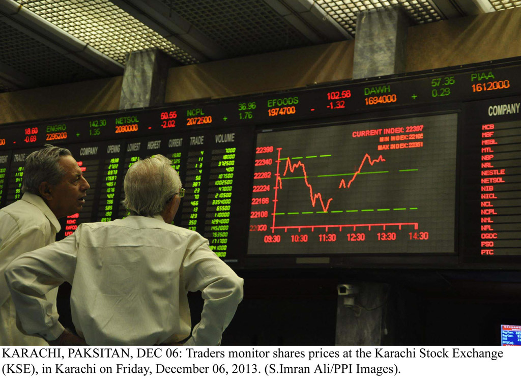 traders monitoring the share price at the karachi stock exchange on friday december 6 2013 photo ppi