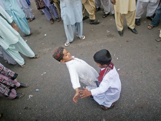 two children dance on the streets while wearing a traditional sindhi topi and ajrak as the province celebrates sindhi culture day photo athar khan express two children dance on the streets while wearing a traditional sindhi topi and ajrak as the province celebrates sindhi culture day photo athar khan express