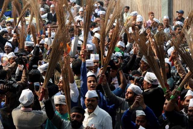 supporters of the indian aam aadmi party common man 039 s party hold brooms the party symbol as they celebrate outside the aap office after their candidate arvind kejriwal won the state assembly election aganist delhi chief minister sheila dikshit in new delhi on december 8 2013 photo afp supporters of the indian aam aadmi party common man 039 s party hold brooms the party symbol as they celebrate outside the aap office after their candidate arvind kejriwal won the state assembly election aganist delhi chief minister sheila dikshit in new delhi on december 8 2013 photo afp