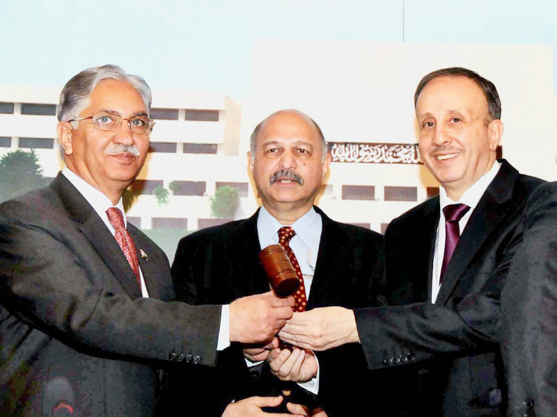 syrian peoples assembly speaker jihad al laham hands over the apa presidency to senate chairman syed nayyar hussain bokhari at the inauguration of 6th plenary session of asian parliamentary assembly photo app