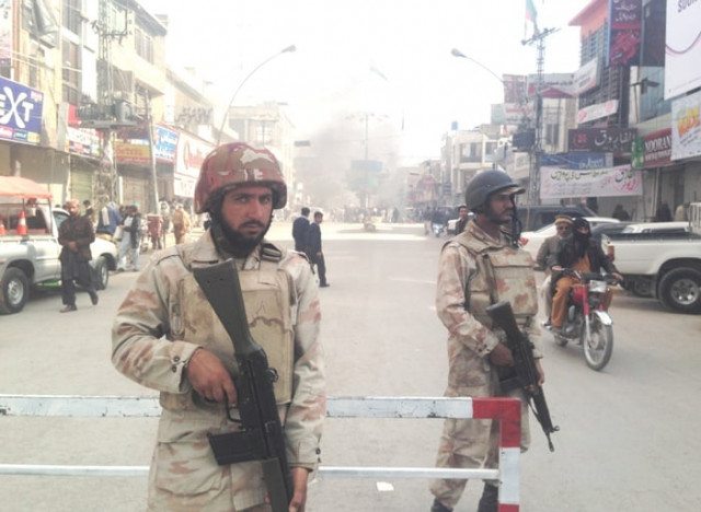 fc personnel blocking a road where protestors burnt tires in quetta photo shehzad baloch express fc personnel blocking a road where protestors burnt tires in quetta photo shehzad baloch express