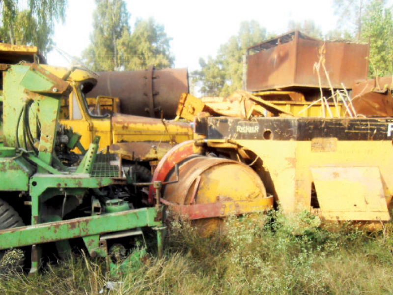 heavy machinery dumped in the parking lot of caa office photo express