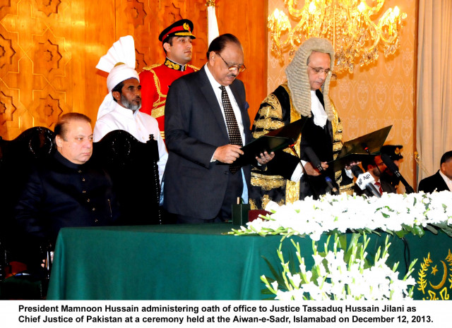 president mamnoon hussain c administers the oath to chief justice of pakistan tassaduq hussain jilani r as prime minister nawaz sharif seated l watches on at the aiwan e sadr in islamabad on thursday photo pid