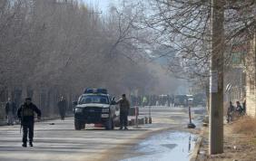 afghanistan security forces stand near the main gate of the national directorate of security where an accidental explosion occurred photo afp