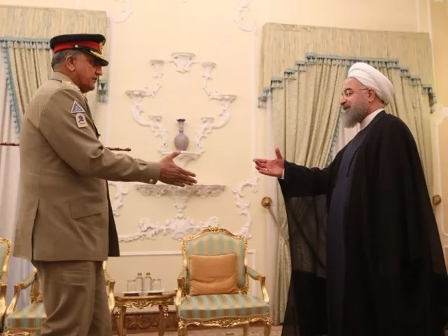 iranian president hassan rowhani greets army chief general qamar javed bajwa in tehran on november 6 2017 photo afp iranian president hassan rowhani greets army chief general qamar javed bajwa in tehran on november 6 2017 photo afp