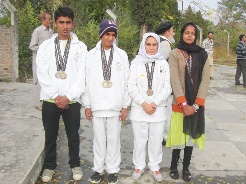 above jazib atif shazma and tehmina display the medals they won at the special olympics 2013 asia pacific games below the building donated by wapda used as the mise campus photos muhammad sadaqat express