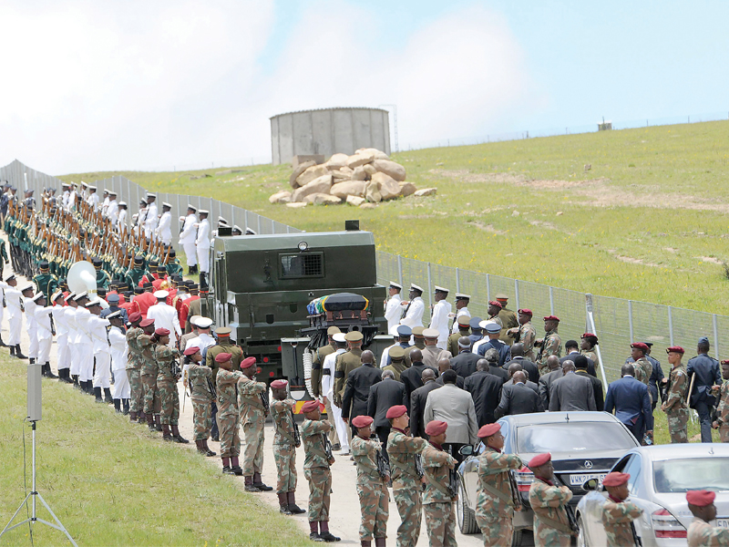 the procession carrying the coffin of nelson mandela moves inside his compound for the funeral ceremony in qunu photo afp