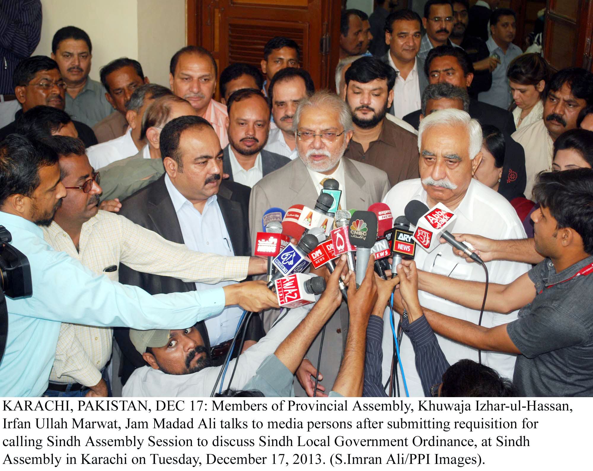 members of the opposition in the sindh assembly khwaja izharul hassan irfanullah marwat jam madad ali talk to the media outside the sindh assembly photo ppi