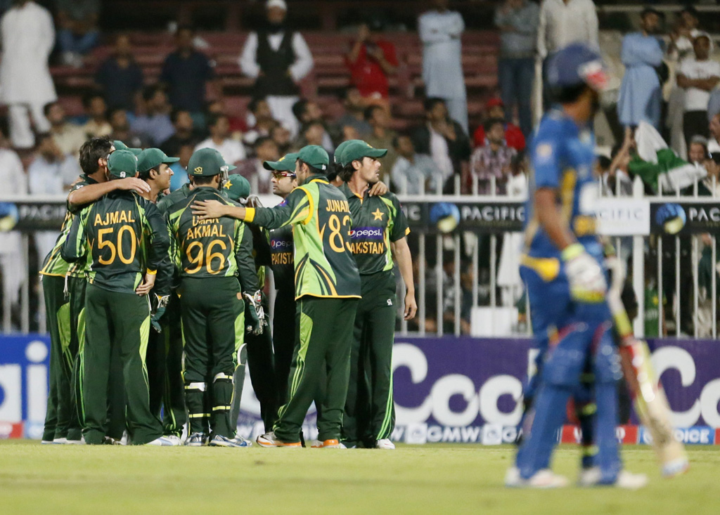 pakistani players celebrate after kumar sangakkara of sri lanka was caught out during the 1st one day international between sri lanka and pakistan in sharjah on december 18 2013 photo afp