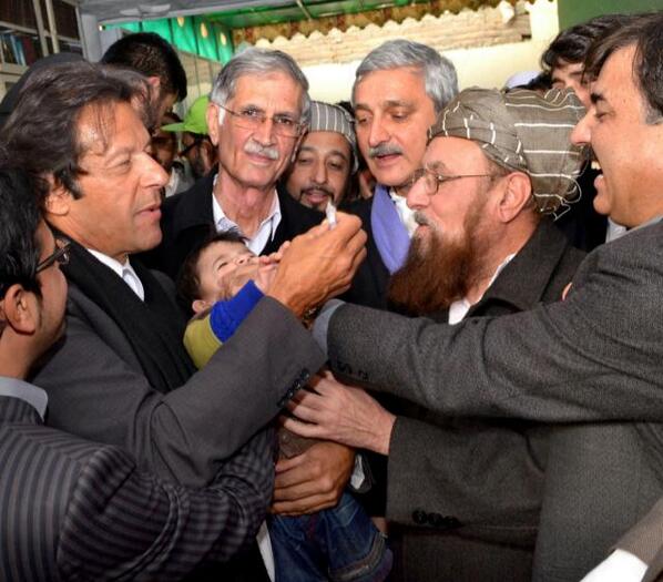 pti chief imran khan l administers polio virus vaccination to child along with jui s chief maulana samiul haq 2nd r as khyber pakhtunkhwa chief minister pervaiz khattak 2nd l and pti leader jahangir tarin c look on photo imrankhanpti