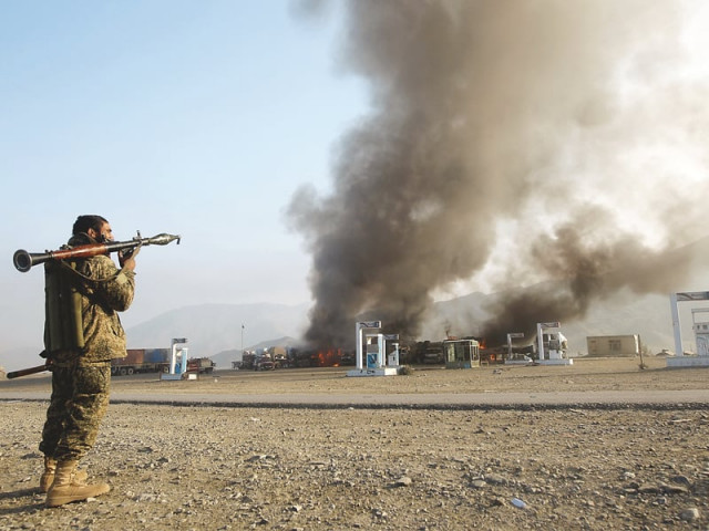 an afghan security official stands guard near torkham after clashes erupted between afghan security forces and taliban photo reuters an afghan security official stands guard near torkham after clashes erupted between afghan security forces and taliban photo reuters