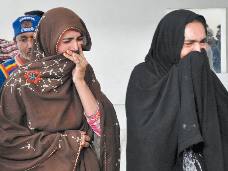 family members of the deceased maid look at her body at the hospital on wednesday photo rashid ajmeri express