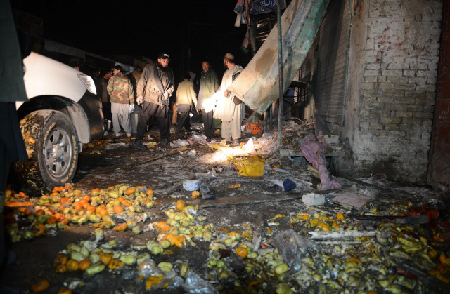 police and security officials inspect the site of an ied bomb blast in quetta on thursday photo banaras khan express police and security officials inspect the site of an ied bomb blast in quetta on thursday photo banaras khan express
