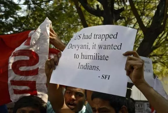 a member of the student federation of india sfi holds up a poster while shouting slogans during a protest outside the u s consulate office in the southern indian city of hyderabad december 19 2013 photo reuters a member of the student federation of india sfi holds up a poster while shouting slogans during a protest outside the u s consulate office in the southern indian city of hyderabad december 19 2013 photo reuters