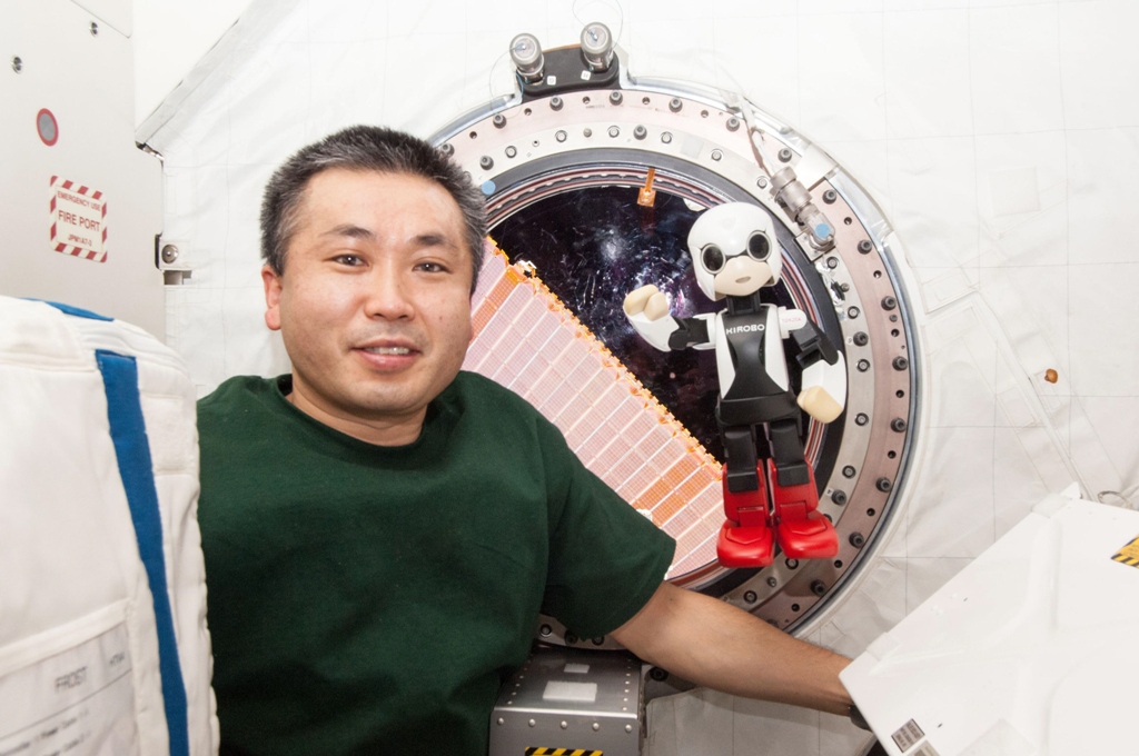 humanoid communication robot kirobo r and japanese astronaut koichi wakata exchange messages in their first communication session between a robot and a human being in space at the international space station iss photo reuters