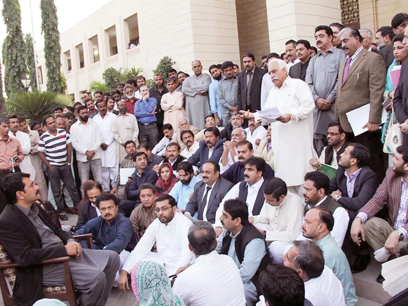 the disgruntled opposition members held their own assembly session out in the open on friday photo online the disgruntled opposition members held their own assembly session out in the open on friday photo online