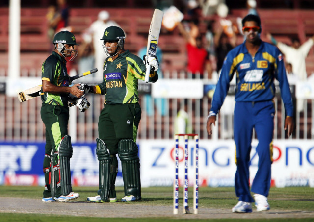 mohammad hafeez l and sharjeel khan c of pakistan salute each other photo afp mohammad hafeez l and sharjeel khan c of pakistan salute each other photo afp