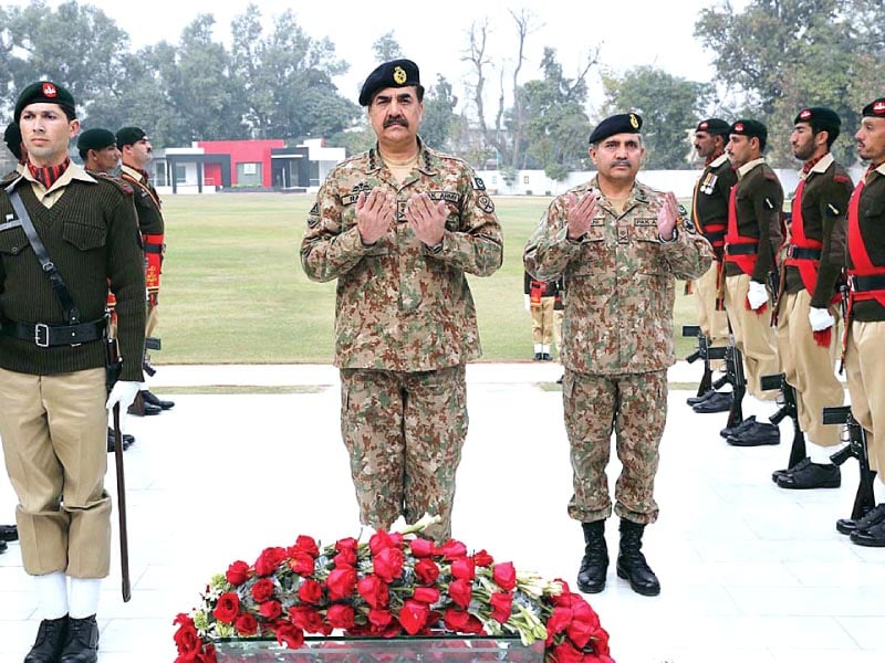 chief of army staff general raheel sharif offering fateha after laying floral wreath at martyrs memorial during his visit to corps headquarters in peshawar photo app