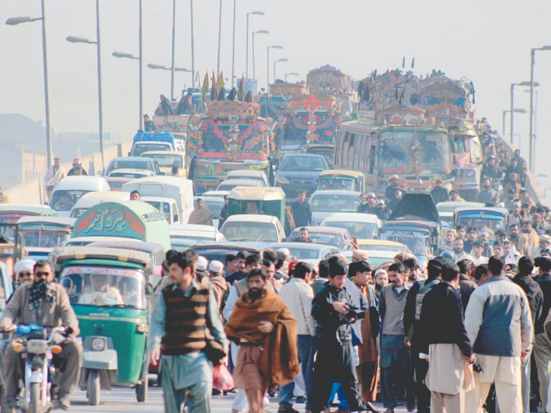 several vehicles were stranded on gt road as fruit and vegetable vendors blocked the thoroughfare in a protest against the killing of haji kabul khan a famous fruit merchant photo muhammad iqbal express