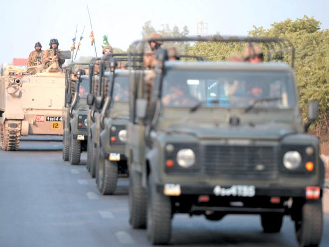 army troops patrol a street in karachi on monday photo afp
