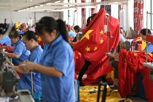 workers make chinese flags at a factory in jiaxing zhejiang province china photo reuters