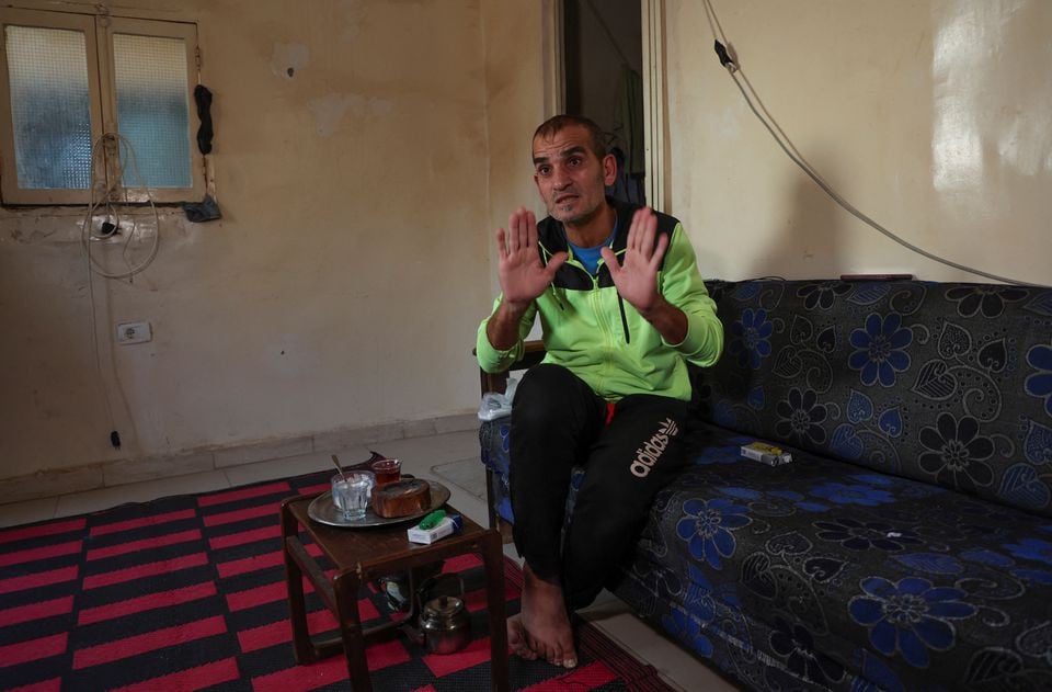 unemployed lebanese hussein hamadeh gestures as he speaks during an interview with reuters inside his home in beirut s southern suburb of ouzai lebanon november 15 2022 reuters mohamed azakir