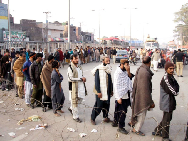 pilgrims stand in a line to enter the shrine on the last day of the urs on tuesday photo abid nawaz express pilgrims stand in a line to enter the shrine on the last day of the urs on tuesday photo abid nawaz express