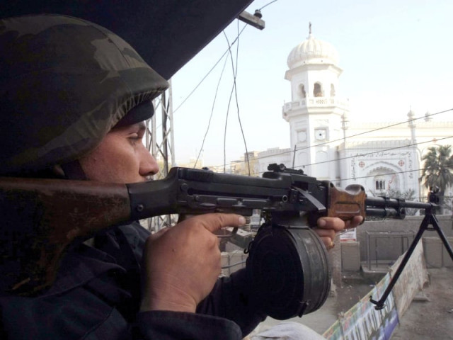 police officials standing guard near peshawar s all saints church in the city s kohati gate area photo ppi police officials standing guard near peshawar s all saints church in the city s kohati gate area photo ppi
