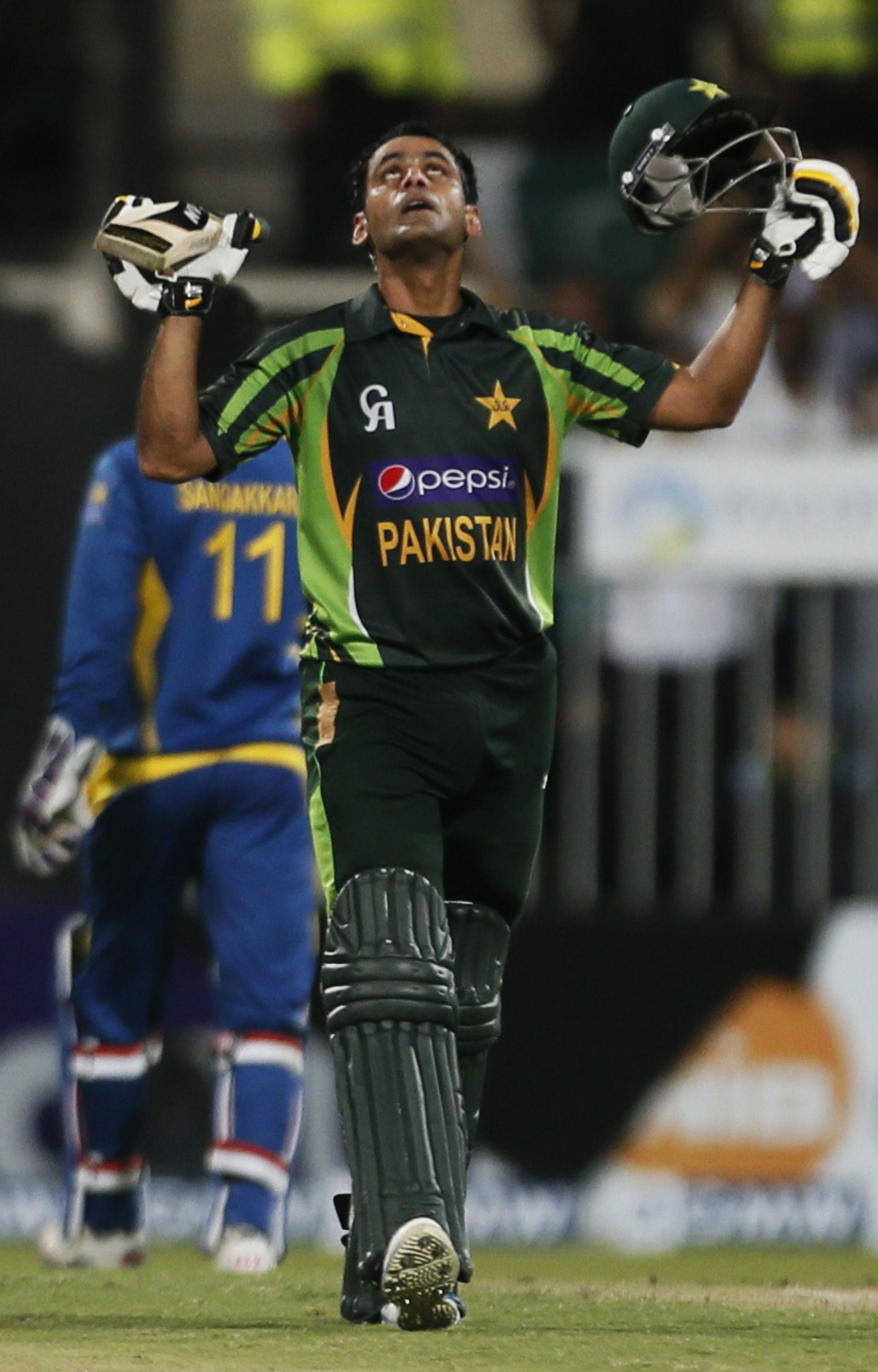 mohammad hafeez celebrates hitting a century 100 runs during the third one day international odi cricket match between pakistan and sri lanka at the sharjah cricket stadium in sharjah on december 22 2013 photo afp