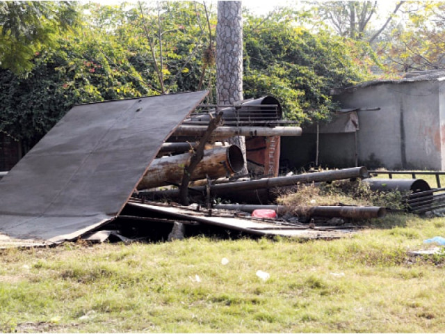 a dysfunctional fountain and discarded billboards at liaquat bagh photo agha mehroz express a dysfunctional fountain and discarded billboards at liaquat bagh photo agha mehroz express