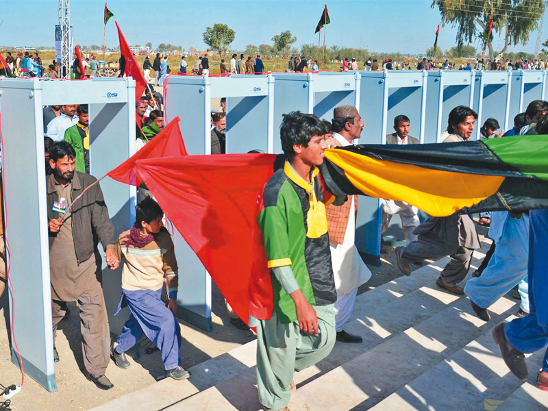 supporters of pakistan peoples party s late leader benazir bhutto arrive at the garhi khuda bux mausoleum on friday to commemorate her sixth death anniversary security was tightened around the area and people were made to go through the walk through gates before entering the premises photo ppi