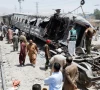 railway workers remove the wreckage of a train damaged in a suicide attack in quetta photo reuters