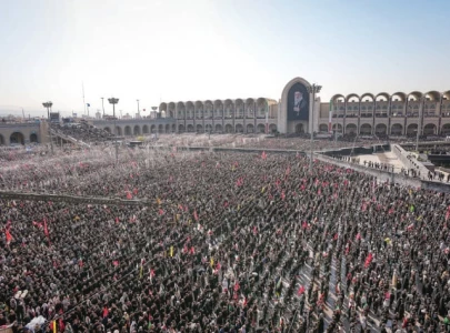 millions turn out as tehran bids farewell to an era