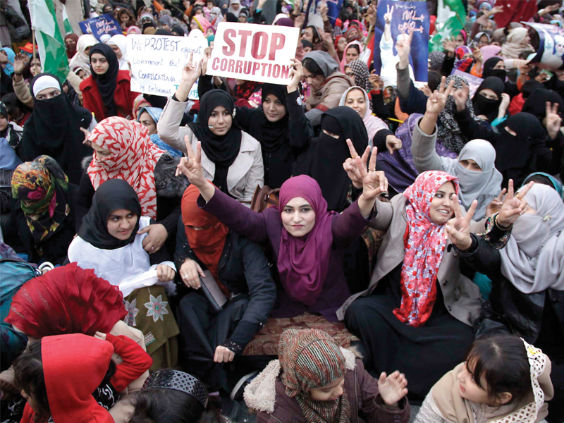 pakistan awami tehreek workers gathered on the mall to demand implementation of article 38 of the constitution promotion of social and economic well being of the people the participants including women holding rolling pins and kitchen items marched from nasser bagh to charing cross photo shafiq malik express