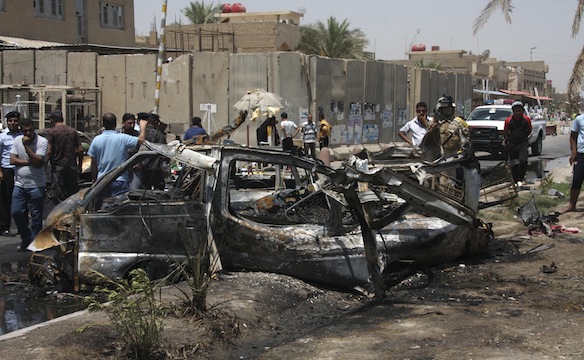 two people were also killed and six wounded by a bombing in a separate district in western baghdad photo reuters