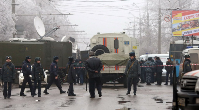 russian policemen guard the site of a deadly bombing on a packed trolleybus in volgograd on december 30 2013 photo afp russian policemen guard the site of a deadly bombing on a packed trolleybus in volgograd on december 30 2013 photo afp