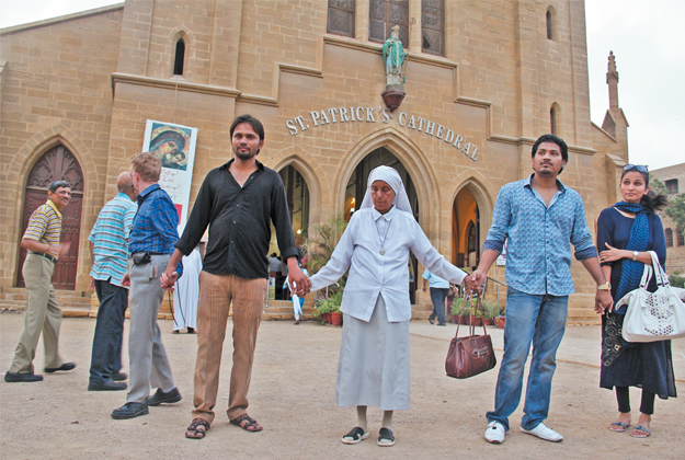 the sunday after the deadly attack on a church in peshawar a large number of people formed a human chain outside st patrick s cathedral as the christian community offered prayers inside photos ayesha mir express