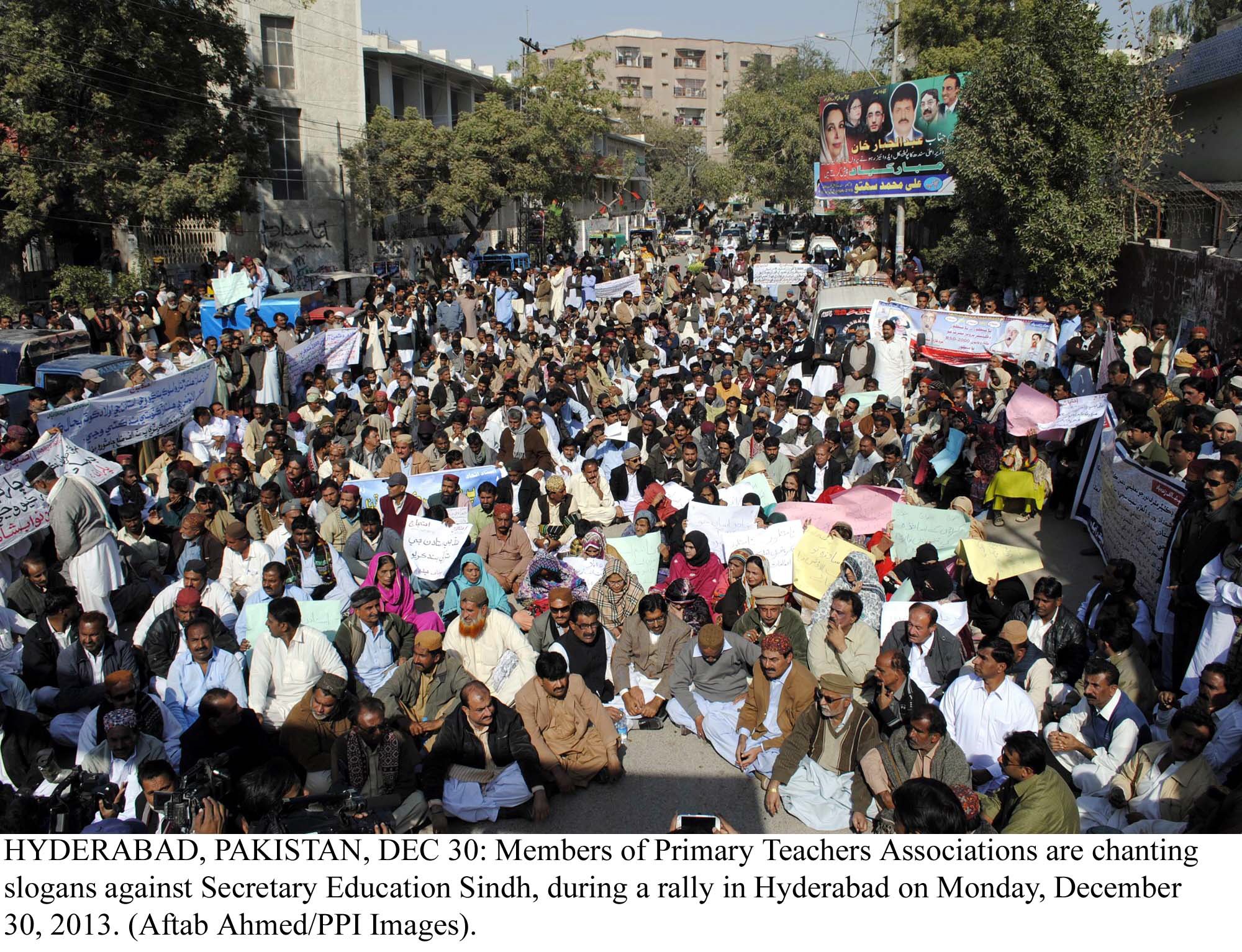 members of primary teachers association are chanting slogans against the sindh secretary education in hyderabad on monday photo ppi