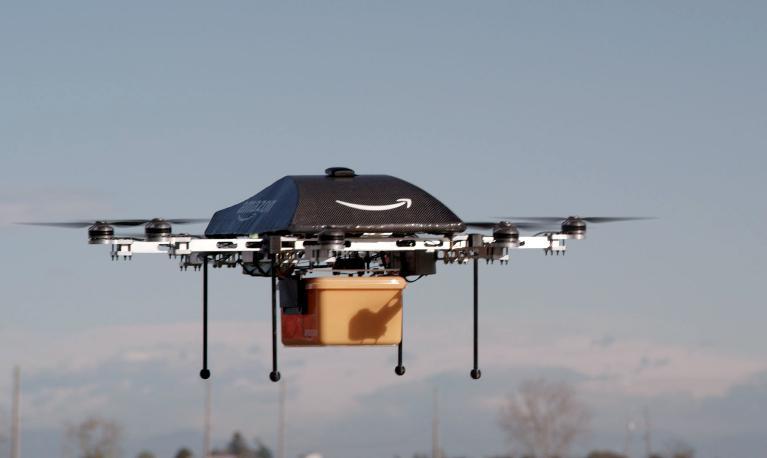 this photo released by amazon on december 1 2013 shows a flying quot octocopter quot mini drone t hat would be used to fly small packages to consumers photo afp