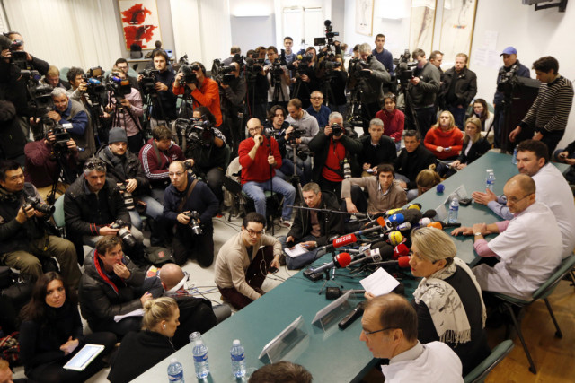 schumacher improving but not out of danger doctors