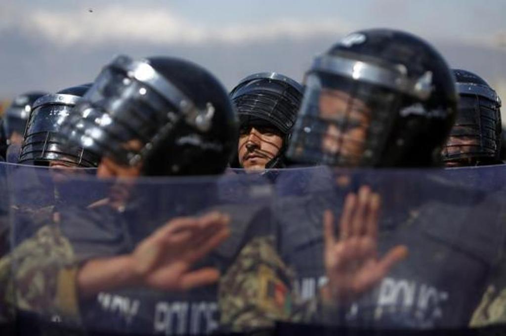 afghan military policemen stand guard during a ceremony handing over the bagram prison to afghan authorities at the u s airbase in bagram north of kabul march 25 2013 photo reuters