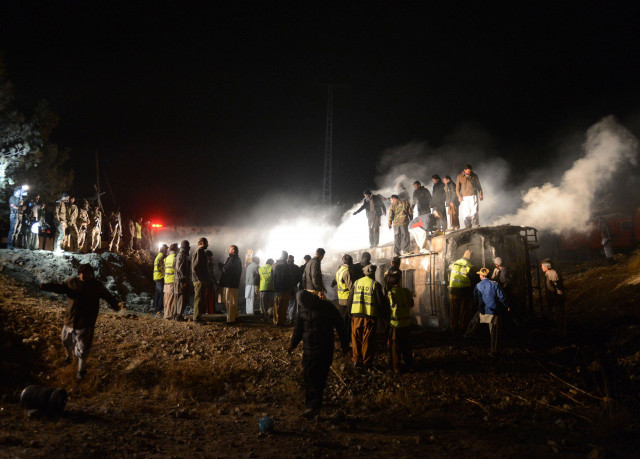 pakistani rescuers and security personnel gather around a burnt passenger bus carrying shia pilgrims at the site of the suicide car bomb attack in akhtarabad on the outskirts of quetta the capital of baluchistan province on january 1 2013 photo afp pakistani rescuers and security personnel gather around a burnt passenger bus carrying shia pilgrims at the site of the suicide car bomb attack in akhtarabad on the outskirts of quetta the capital of baluchistan province on january 1 2013 photo afp