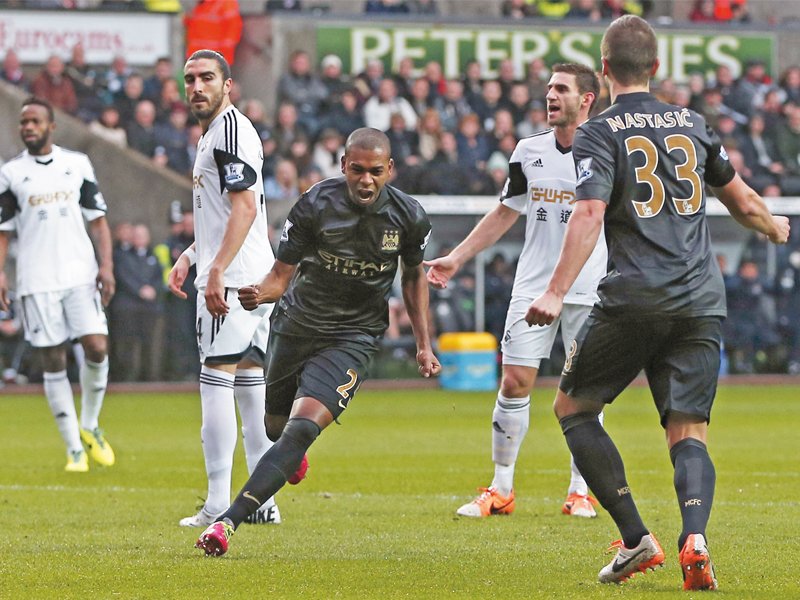 manchester city took their goal tally to 57 in the premier league after winning 3 2 away at swansea photo afp