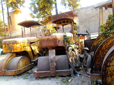 forgotten road rollers rusting away in parking lot forgotten road rollers rusting away in parking lot