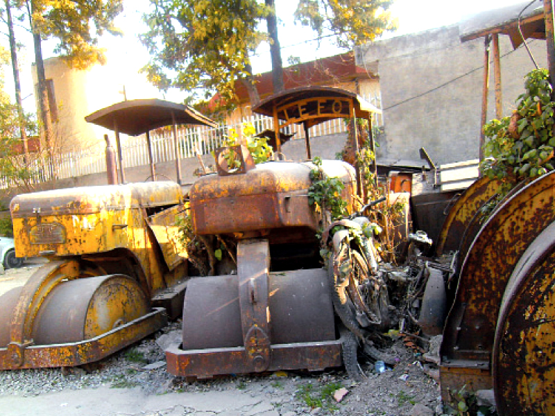 the useless road rollers have become hosts for leafy plants photo kashif abbasi express