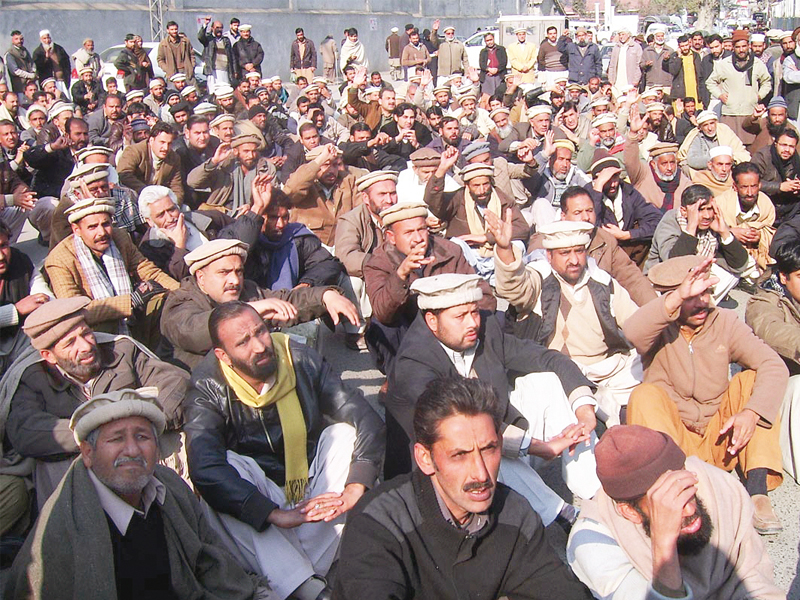 pesco employees protest outside abbottabad press club against the provincial government s potential takeover of the company photo online