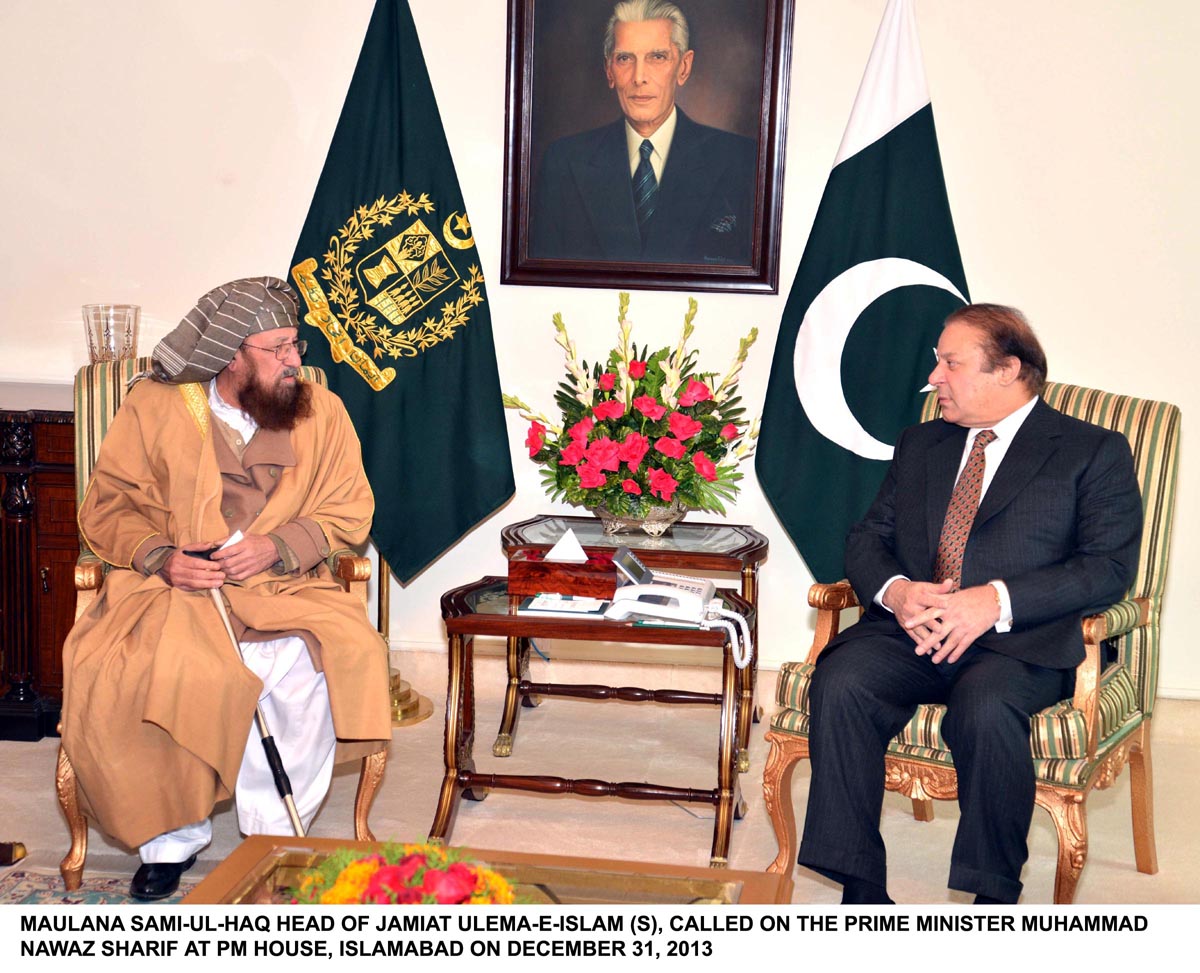 maulana samiul haq l speaks with prime minister nawaz sharif r at the pm house on tuesday december 31 2013 photo pid