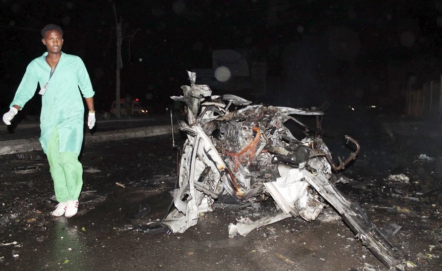 a firefighter walks at the scene of an explosion outside the jazira hotel in mogadishu january 1 2014 photo reuters