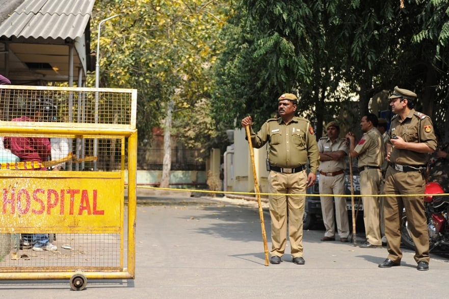 indian policemen keep watch outside the deen diyal upadhyay hospital mortuary after the main accused of another gang rape case was found dead in his prison cell in new delhi on march 11 2013